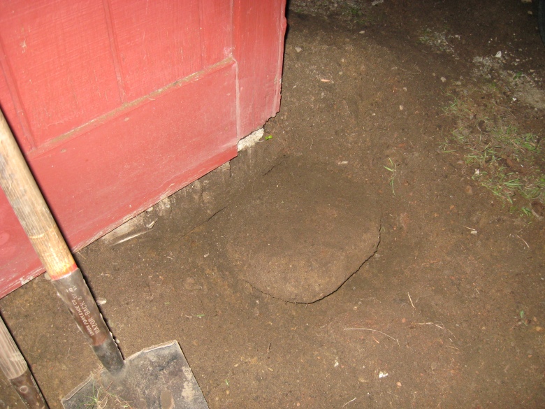 concrete disk by cinderblock holding up porch
